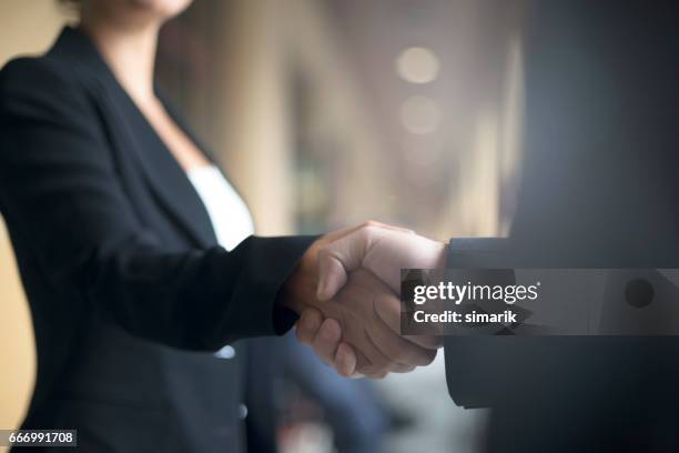 handshake - achieve woman stock pictures, royalty-free photos & images