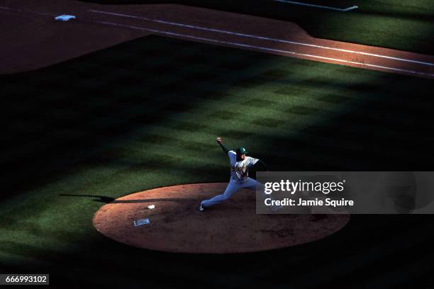 Santiago Casilla of the Oakland Athletics pitches during the Kansas City Royals 2017 home opener at Kauffman Stadium on April 10, 2017 in Kansas...