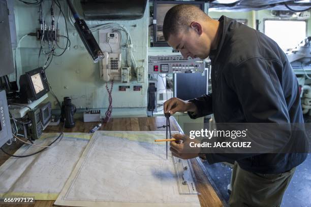 An Israeli soldier onboard the Israeli vessel Saar 5 Class Corvette "INS Hanit" takes part in a training session during the "Novel Dina 17" exercise...