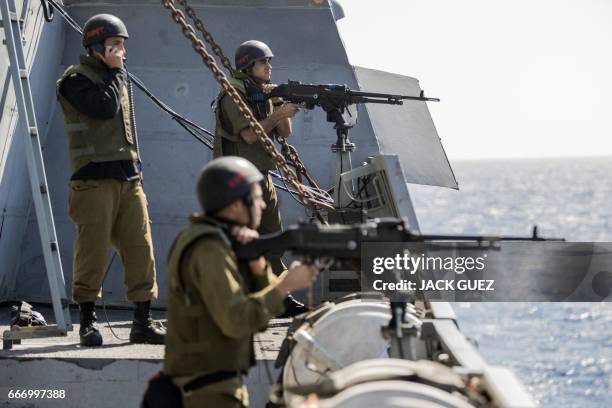 Israeli soldiers onboard the Israeli vessel Saar 5 Class Corvette "INS Hanit" take part in the "Novel Dina 17" training session in the Mediterranean...