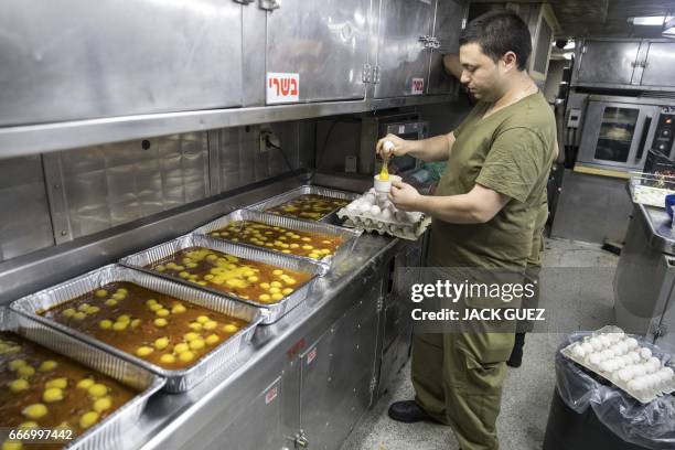 Israeli soldier onboard the Israeli vessel Saar 5 Class Corvette "INS Hanit" prepares food during the "Novel Dina 17" exercise in the Mediterranean...