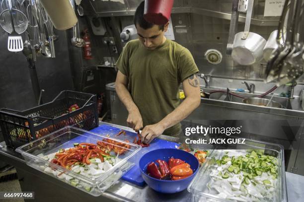 Israeli soldier onboard the Israeli vessel Saar 5 Class Corvette "INS Hanit" prepares food during the "Novel Dina 17" exercise in the Mediterranean...