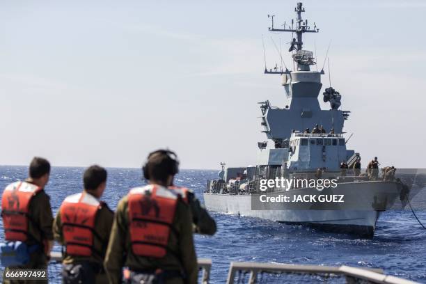 Israeli soldiers onboard the Israeli vessel Saar 5 Class Corvette "INS Hanit" attend a training session during the "Novel Dina 17" exercise in the...