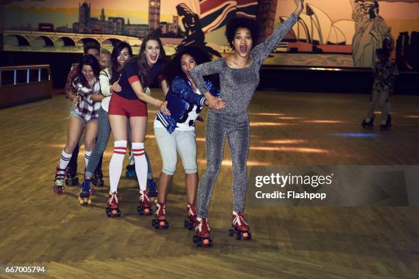 friends having fun at roller disco - indoor skating stock pictures, royalty-free photos & images