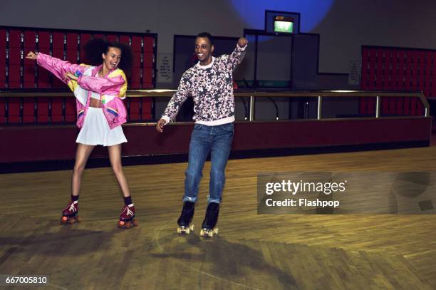 friends having fun at roller disco - roller skates stock pictures, royalty-free photos & images