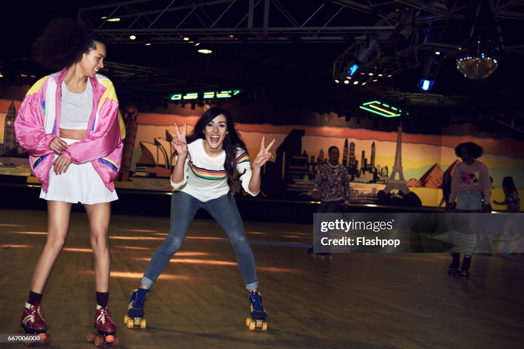 Friends having fun at roller disco