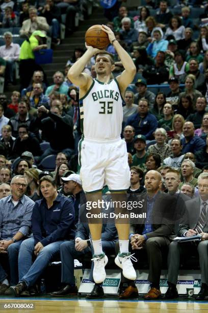 Mirza Teletovic of the Milwaukee Bucks attempts a shot in the second quarter against the Charlotte Hornets at BMO Harris Bradley Center on April 10,...