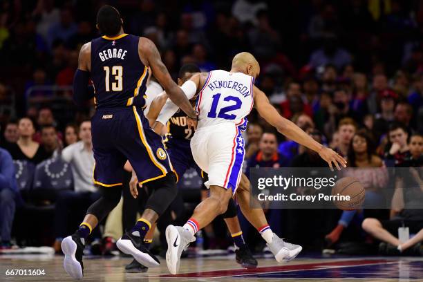 Paul George of the Indiana Pacers defends against Gerald Henderson of the Philadelphia 76ers during the fourth quarter at the Wells Fargo Center on...