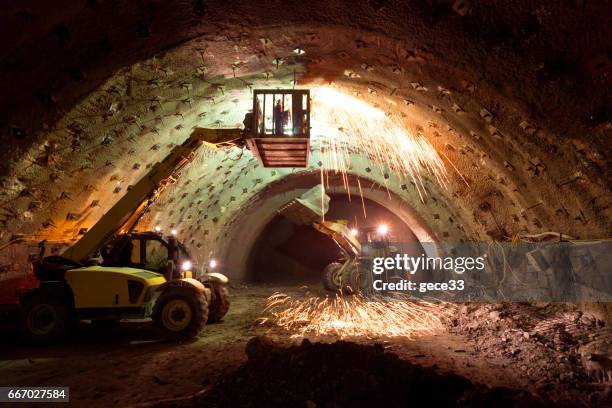 construction machinery working in tunnel construction - underground mining stock pictures, royalty-free photos & images