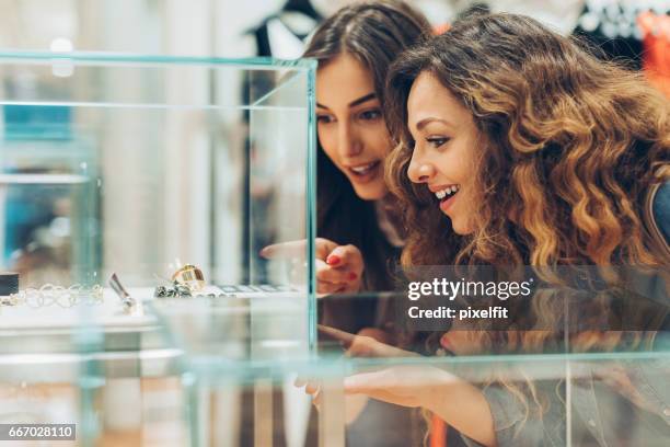 admiring golden jewelry - luxury girl imagens e fotografias de stock