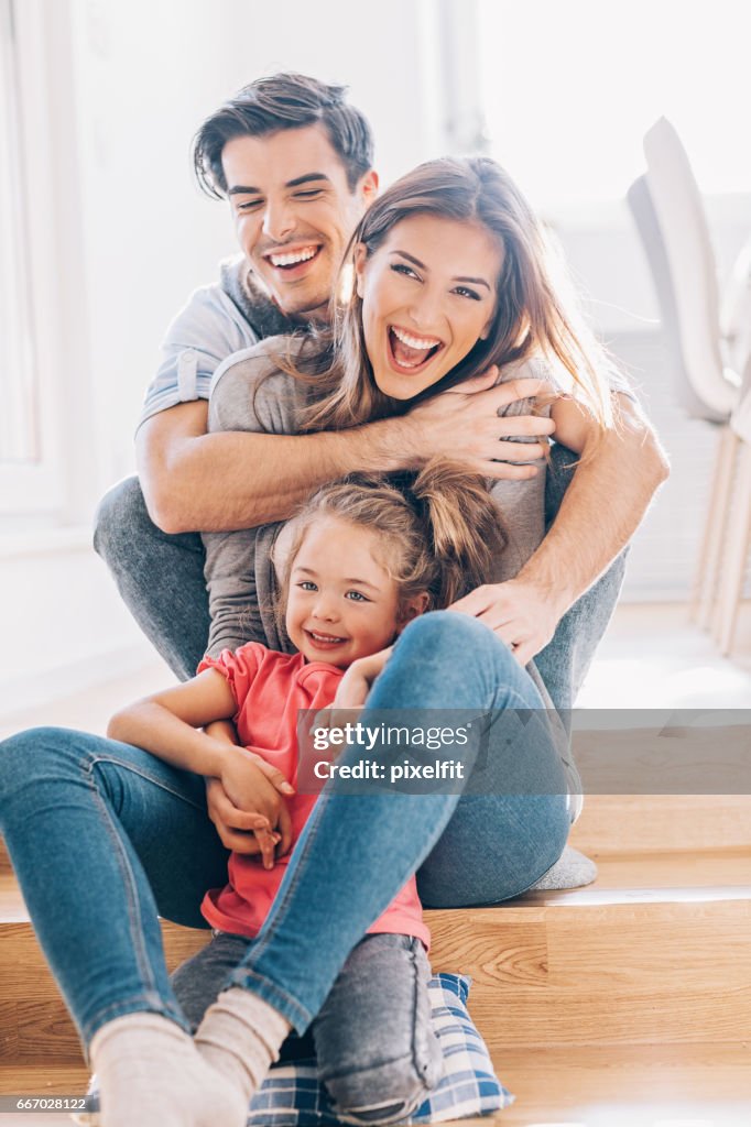 Lovely young family with one child at home