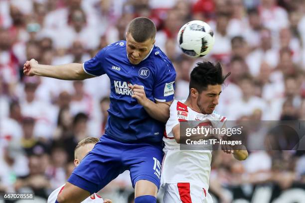 Berkay Oezcan of Stuttgart and Florian Kamberi of Karlsruher SC battle for the ball during the Second Bundesliga match between VfB Stuttgart and...