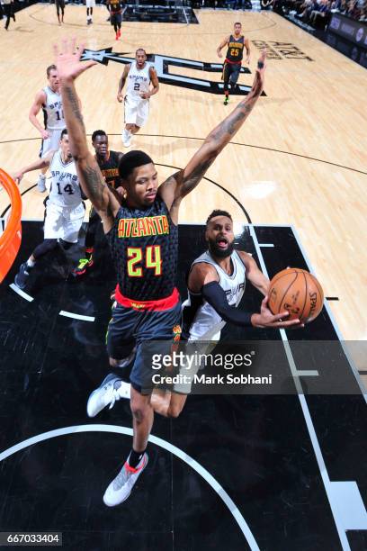 Patty Mills of the San Antonio Spurs goes for a lay up during the game against the Atlanta Hawks on March 13, 2017 at the AT&T Center in San Antonio,...
