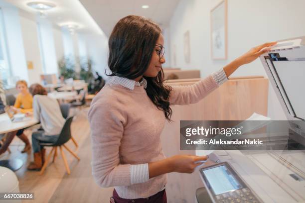 young woman on internship - photocopier stock pictures, royalty-free photos & images