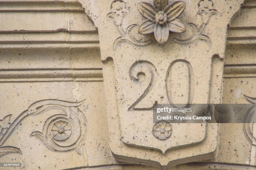 Number 20 carved in wall