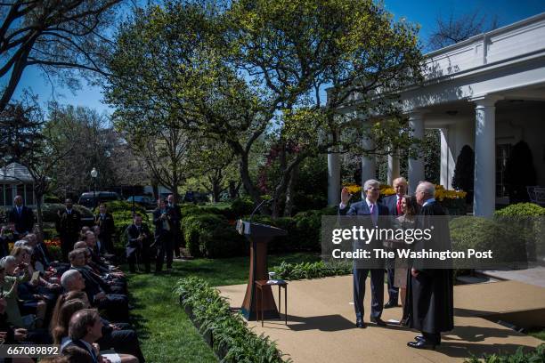 President Donald Trump watches as Supreme Court Justice Anthony Kennedy administers the judicial oath to Judge Neil Gorsuch during a swearing-in...