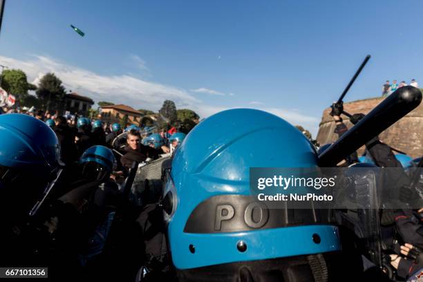 Demonstrators clash with riot police in Lucca, Italy, on April 10, 2017 during a demonstration against G7 Foreign Minister Meeting in Lucca on April...