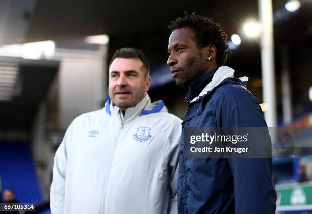 Ugo Ehiogu, coach of Tottenham Hotspur chats with Manager of Everton David Unsworth ahead of kick off during the Premier League 2 match between...