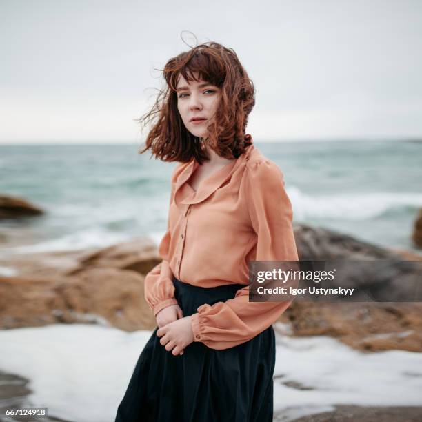 caucasian woman walking near the sea - beach model stock pictures, royalty-free photos & images