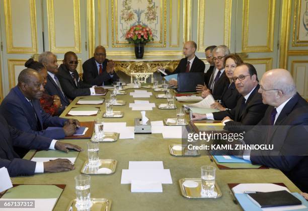 French President Francois Hollande , Minister for Ecology, Sustainable Development and Energy Segolene Royal and Finance Minister Michel Sapin meet...