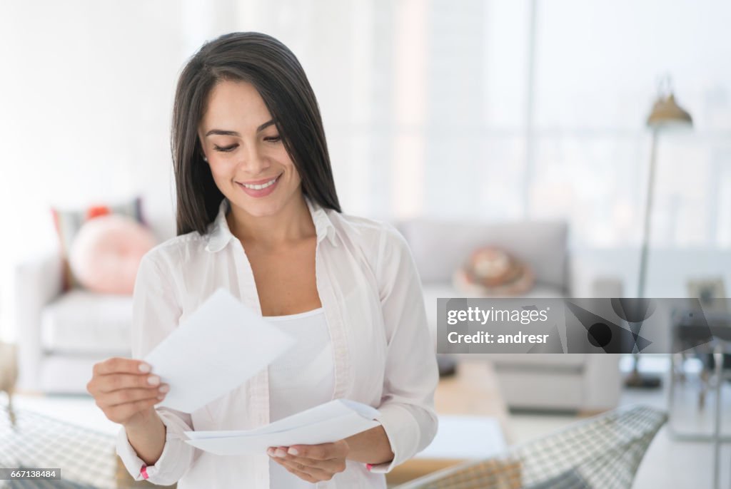 Woman at home getting the mail