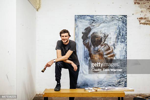 portrait of young artist - male artist painting stock pictures, royalty-free photos & images