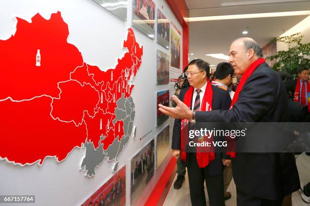 Chairman and chief executive officer of Coca-Cola Muhtar Kent introduces the situation of Coca-Cola's factory in Changsha as the World's largest soft...