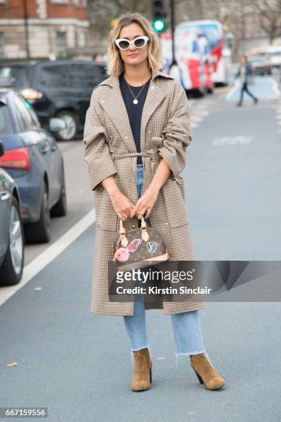 Fashion blogger Anne-Laure Mais, Adenorah wears Manouska trousers, Louis Vuitton bag, Levi"u2019s jeans, JONAK shoes and vintage sunglasses on day 4...
