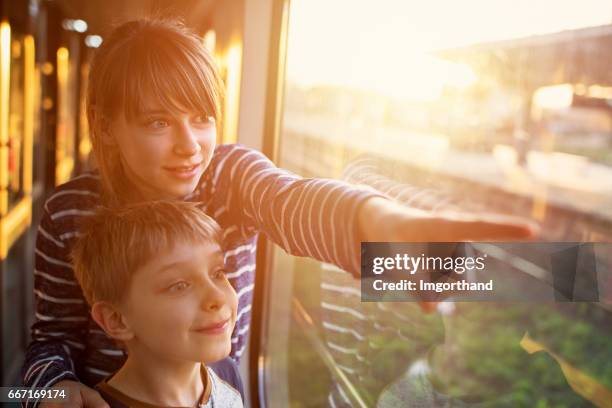 Brother Train Ride 28,580 Brother And Sister Travel Stock Photos, High-Res Pictures, and ...