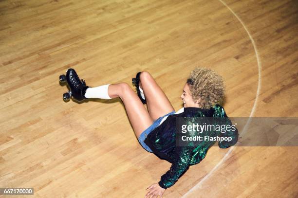 woman having fun at roller disco - women in slips stock pictures, royalty-free photos & images