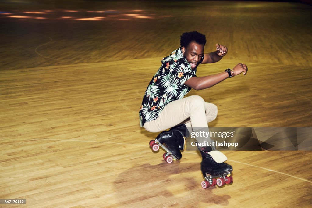 Man having fun at roller disco