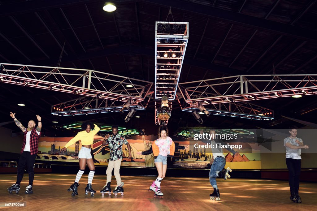 Friends having fun at roller disco