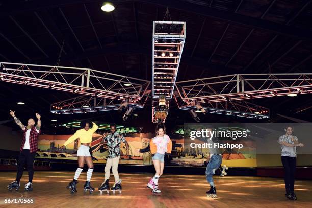 friends having fun at roller disco - roller rink stock pictures, royalty-free photos & images