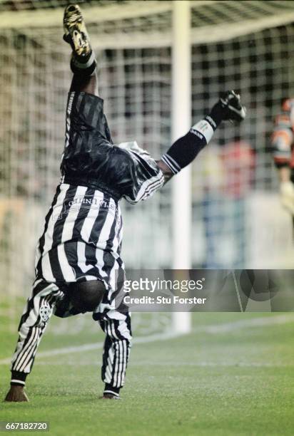 Newcastle United striker Faustino Asprilla does his trademark cartwheel celebration after scoring his and Newcastle's second goal, with a bullet...