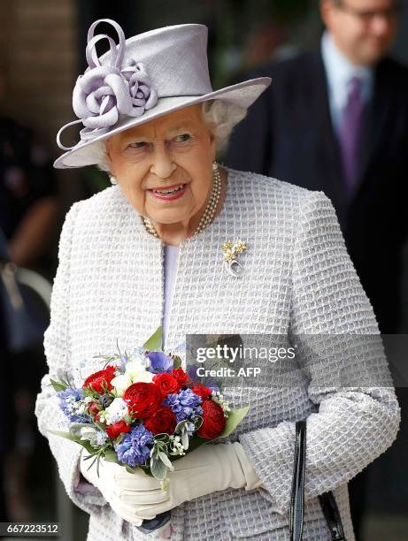 Britain's Queen Elizabeth II leaves following her tour of Priory View, an independent living scheme for older residents, in Dunstable, north-west of...