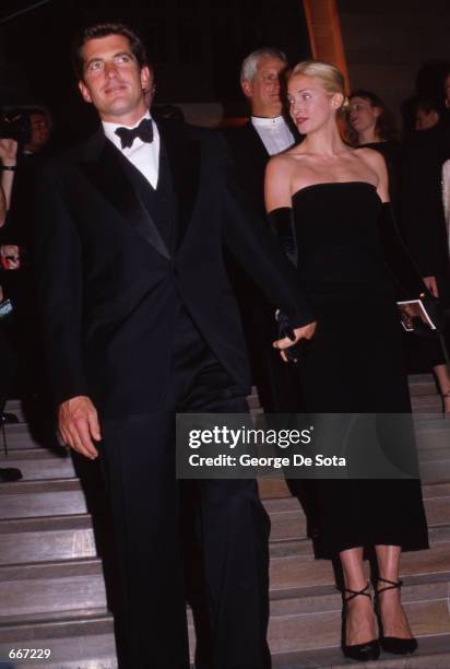 John F. Kennedy, Jr., with his wife Carolyn attend a function in honor of his mother, Jacqueline Kennedy, October 4 at Grand Central Station in New...