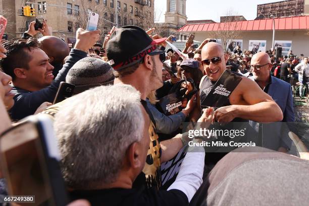 Vin Diesel and Michelle Rodriguez visit Washington Heights on behalf of "The Fate Of The Furious" on April 11, 2017 in New York City.