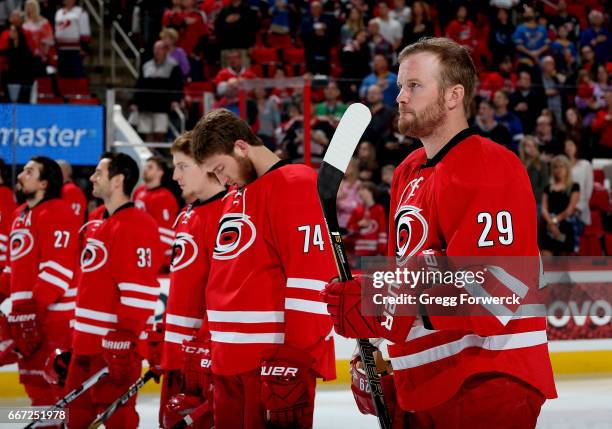 Bryan Bickell of the Carolina Hurricanes and teammates are photographed during the National Anthem prior to an NHL game against the St. Louis Blues...