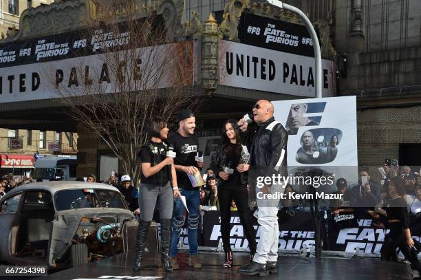 Birmania Rios and William Valdes speak to Michelle Rodriguez and Vin Diesel as they visit Washington Heights on behalf of "The Fate Of The Furious"...