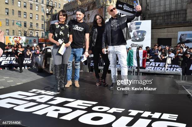 Birmania Rios and William Valdes speak to Michelle Rodriguez and Vin Diesel as they visit Washington Heights on behalf of "The Fate Of The Furious"...