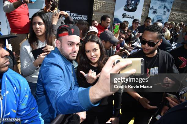 Vin Diesel and Michelle Rodriguez visit Washington Heights on behalf of "The Fate Of The Furious" on April 11, 2017 in New York City.