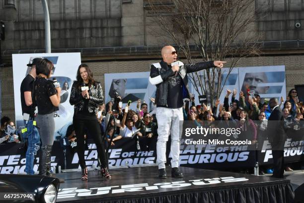 Birmania Rios and William Valdes speak to Michelle Rodriguez and Vin Diesel as they visit Washington Heights on behalf of "The Fate Of The Furious"...