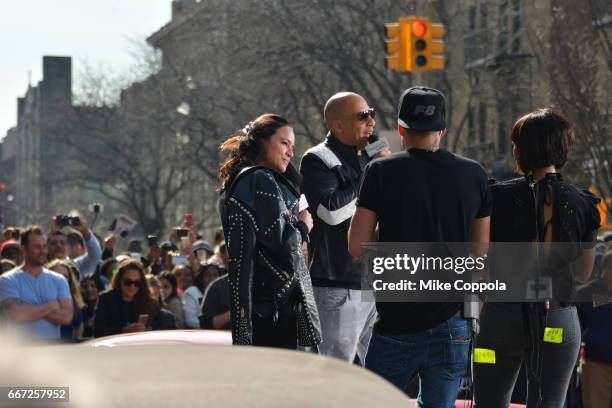 Birmania Rios and William Valdes speak to Michelle Rodriguez and Vin Diesel as they visit Washington Heights on behalf of "The Fate Of The Furious"...