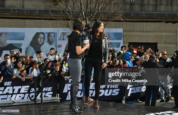 Birmania Rios and William Valdes speak to Michelle Rodriguez and Vin Diesel as they visit Washington Heights on behalf of "The Fate Of The Furious"...