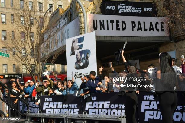 Fans react as Vin Diesel and Michelle Rodriguez visit Washington Heights on behalf of "The Fate Of The Furious" on April 11, 2017 in New York City.