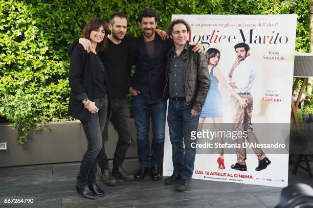 Kasia Smutniak, Simone Godano, Pierfrancesco Favino and Valerio Aprea attend a photocall for 'Moglie E Marito' on April 11, 2017 in Milan, Italy.