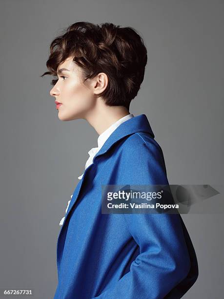 wont in blue coat - portrait profile stock-fotos und bilder