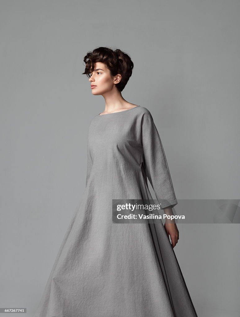 Young elegant woman posing in studio