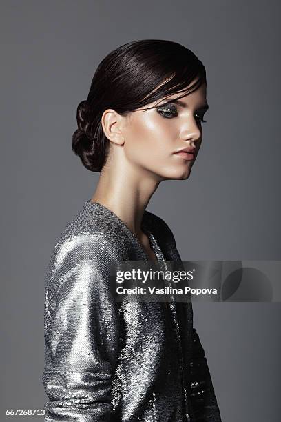 beautiful woman wearing sequin jacket - sequin jacket stock-fotos und bilder