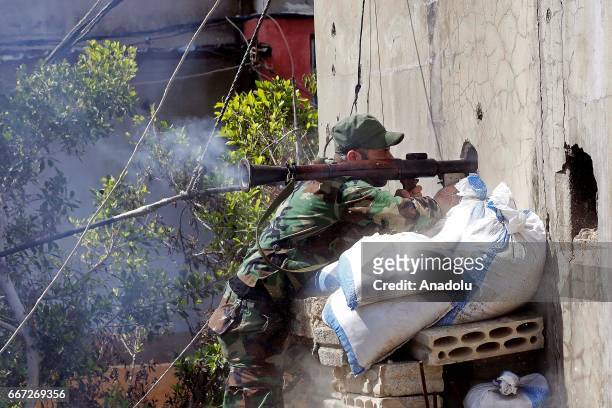 An Al-Fatah Movement militant fires an RPG during a fire exchange as clashes between members of Palestinian Fatah Movement and Bilal Badr continue at...